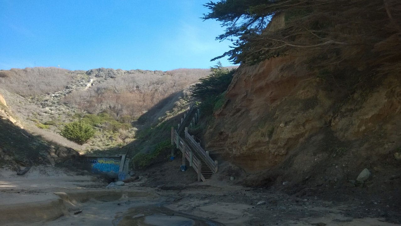 Photo of stairs going up from the beach