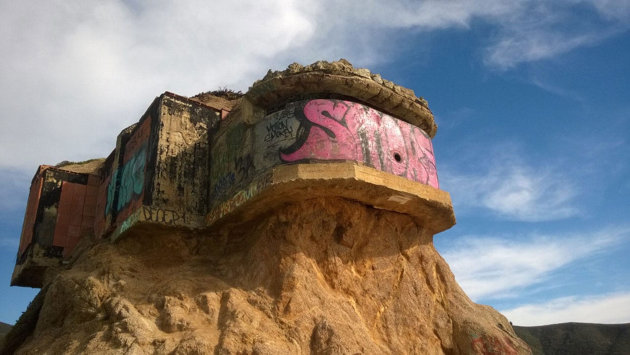 Photo of a graffiti covered bunker